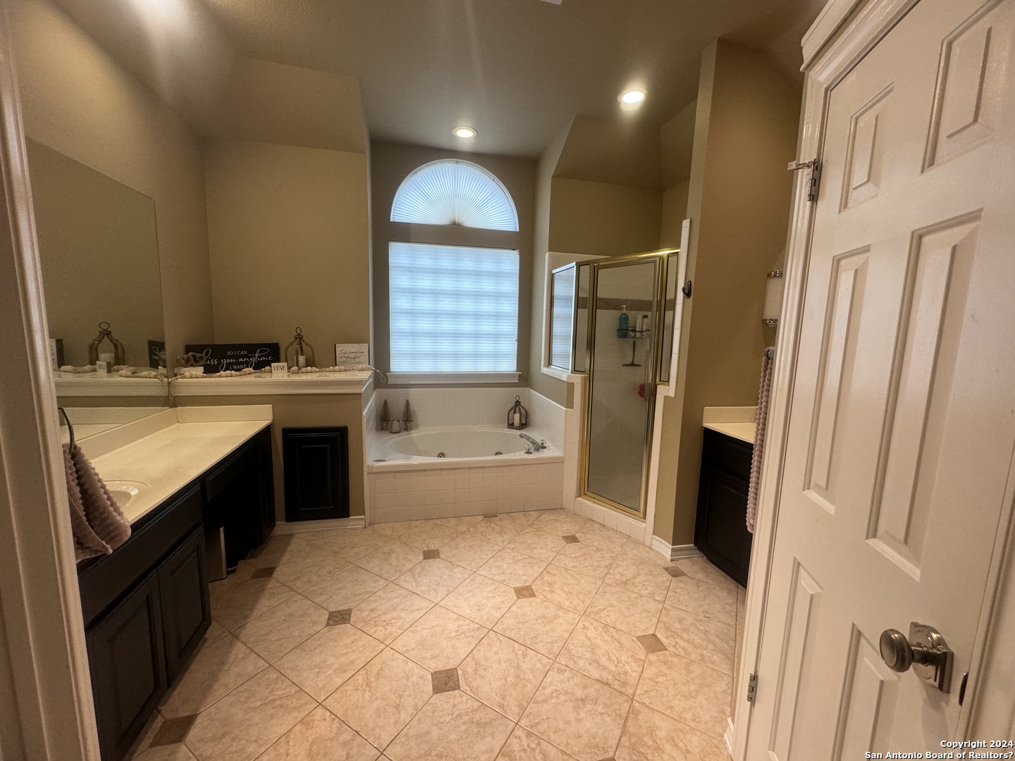 3 Lindquist San Antonio, TX 78248 - Photo 8 of 35 a bathroom with a sink a toilet a mirror and a tub