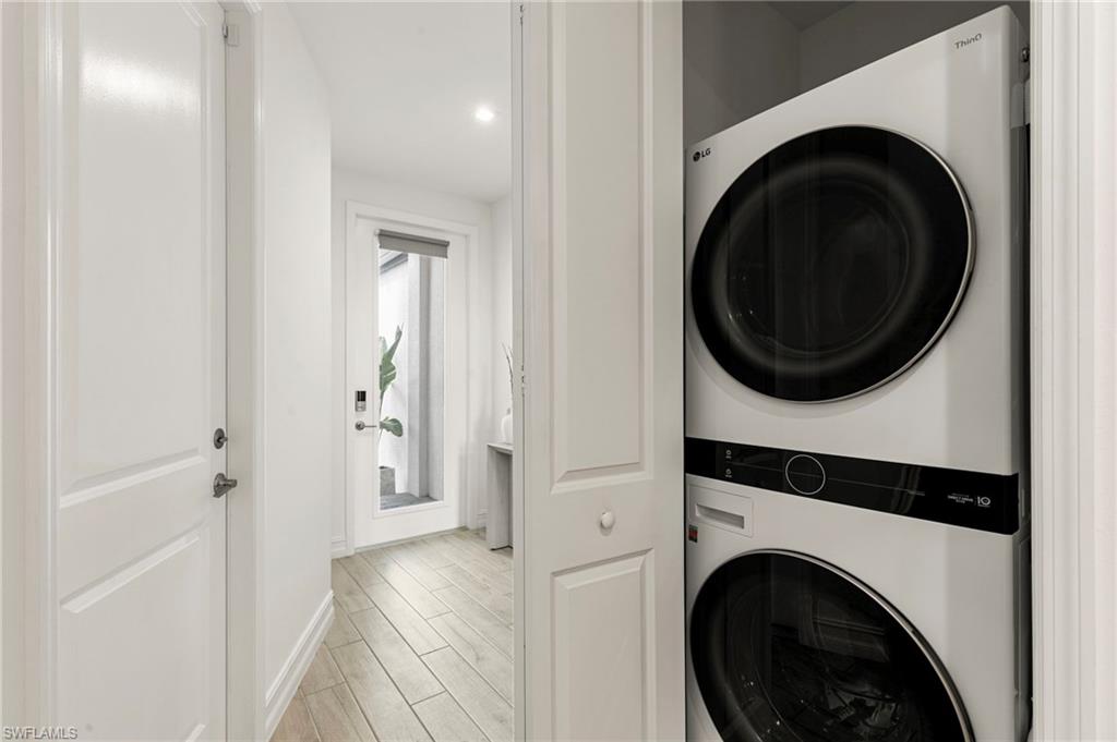7622 Rockefeller Drive Naples, FL 34119 - Photo 26 of 35 a view of a hallway with washer and dryer