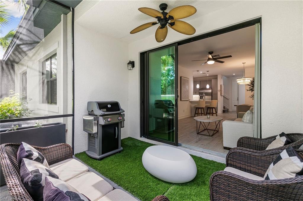 7622 Rockefeller Drive Naples, FL 34119 - Photo 29 of 35 a living room with furniture and a rug