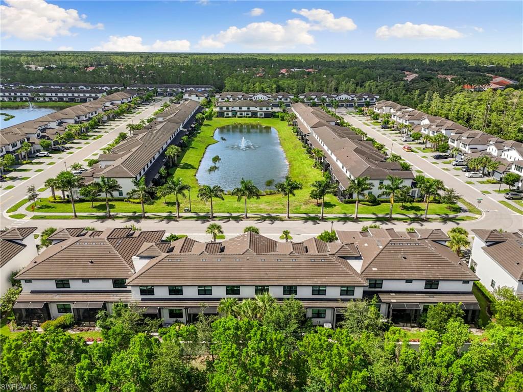7622 Rockefeller Drive Naples, FL 34119 - Photo 31 of 35 an aerial view of residential houses with outdoor space and a lake view