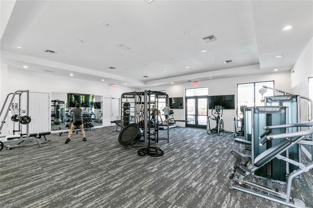 7622 Rockefeller Drive Naples, FL 34119 - Photo 33 of 35 a view of a room with gym equipment