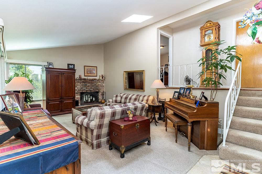 11325 Maverick Lane Reno, NV 89511 - Photo 2 of 20 a living room with furniture and a flat screen tv