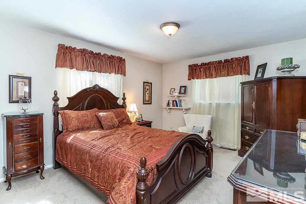 11325 Maverick Lane Reno, NV 89511 - Photo 6 of 20 a bedroom with a bed and wooden floor