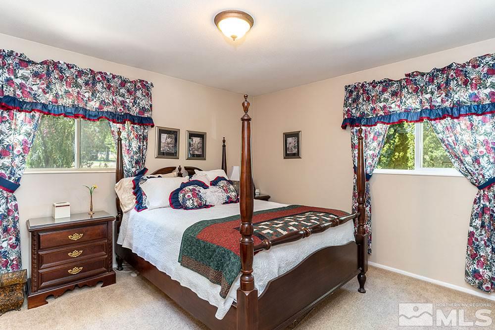 11325 Maverick Lane Reno, NV 89511 - Photo 7 of 20 a bedroom with a bed and window