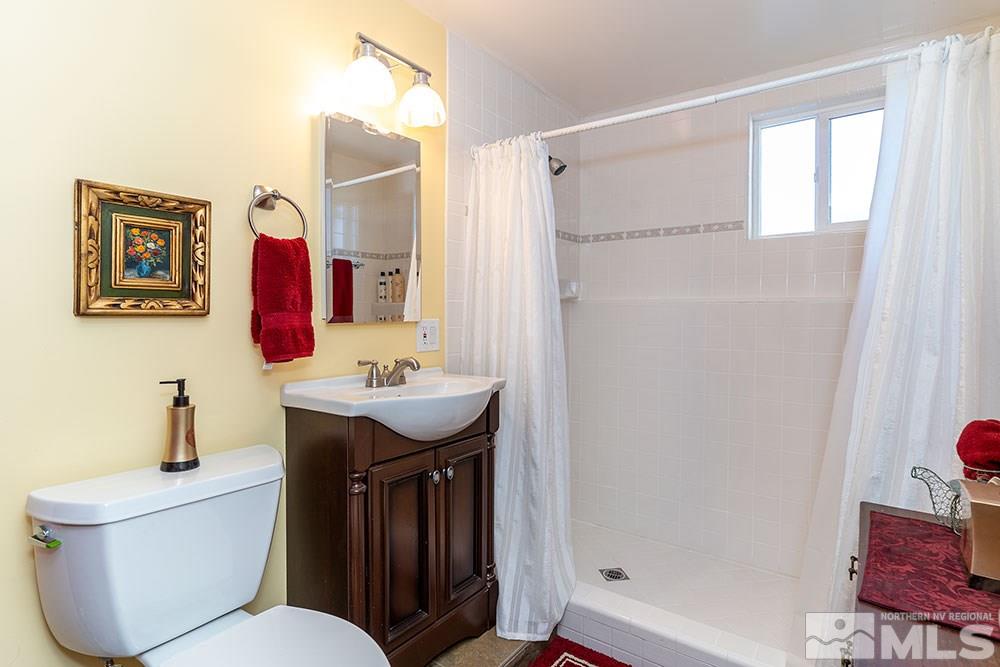 11325 Maverick Lane Reno, NV 89511 - Photo 9 of 20 a bathroom with a sink toilet and shower