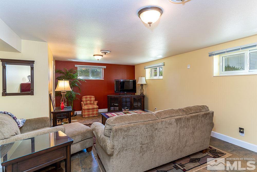 11325 Maverick Lane Reno, NV 89511 - Photo 10 of 20 a living room with furniture and a flat screen tv