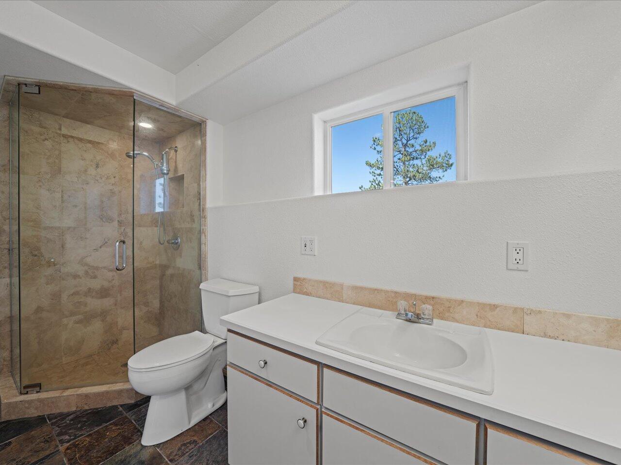 55 Valley View Road Ridgway, CO 81432 - Photo 22 of 39 a bathroom with a sink a toilet and shower