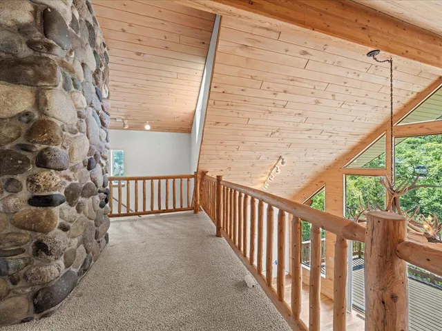 a view of balcony with wooden floor