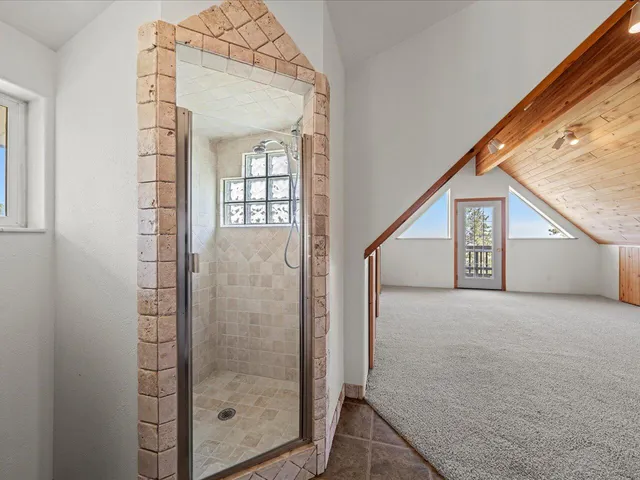 a view of balcony with wooden floor