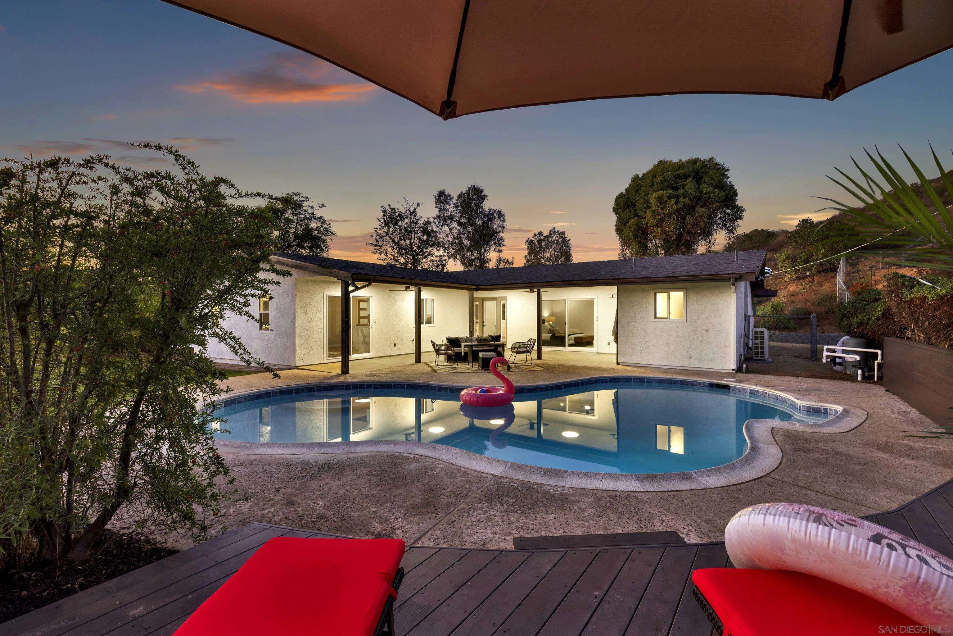 a view of a chairs and table in the patio