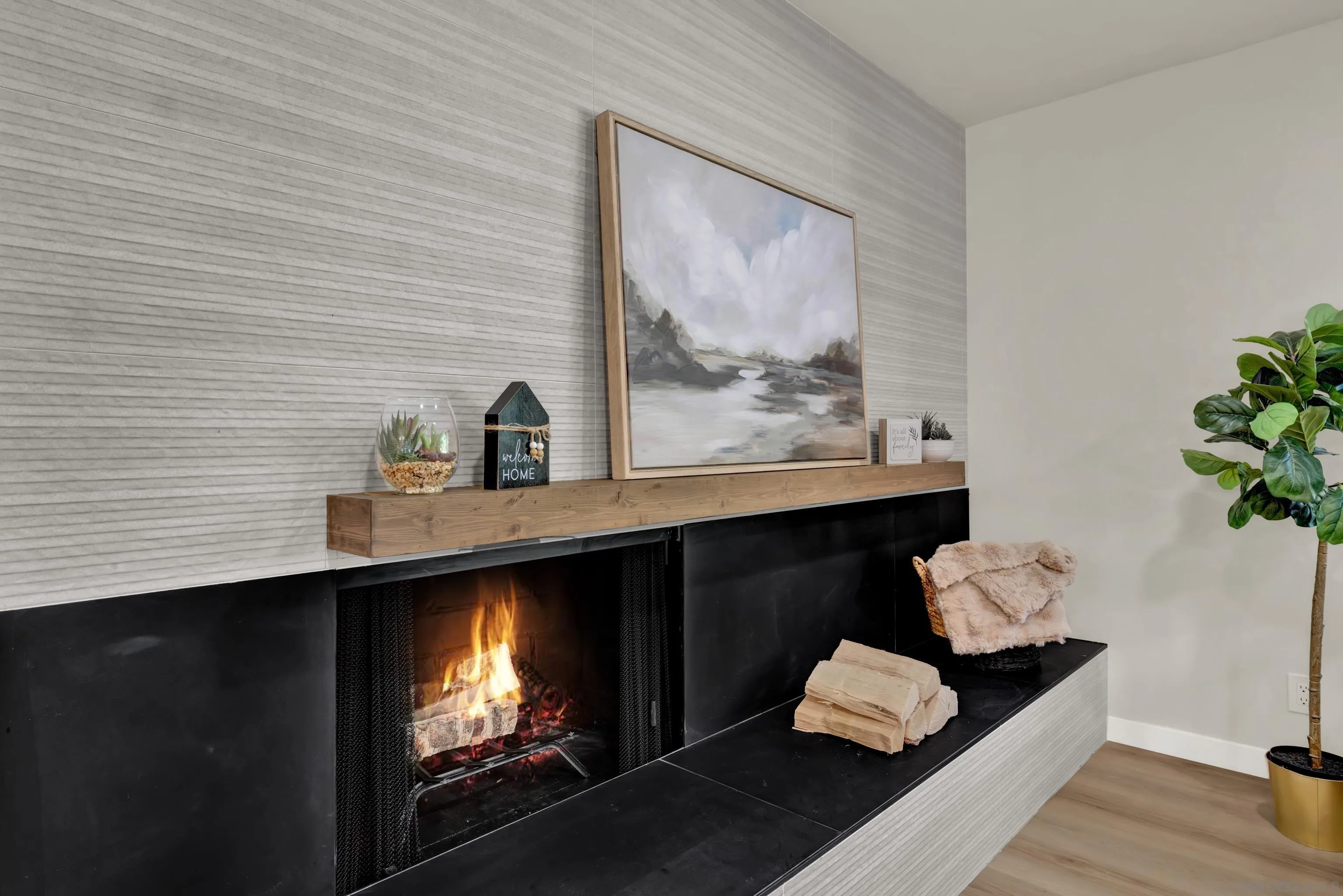 14407 Mountain Road Poway, CA 92064 - Photo 13 of 75 a room with painting on the wall and a potted plant