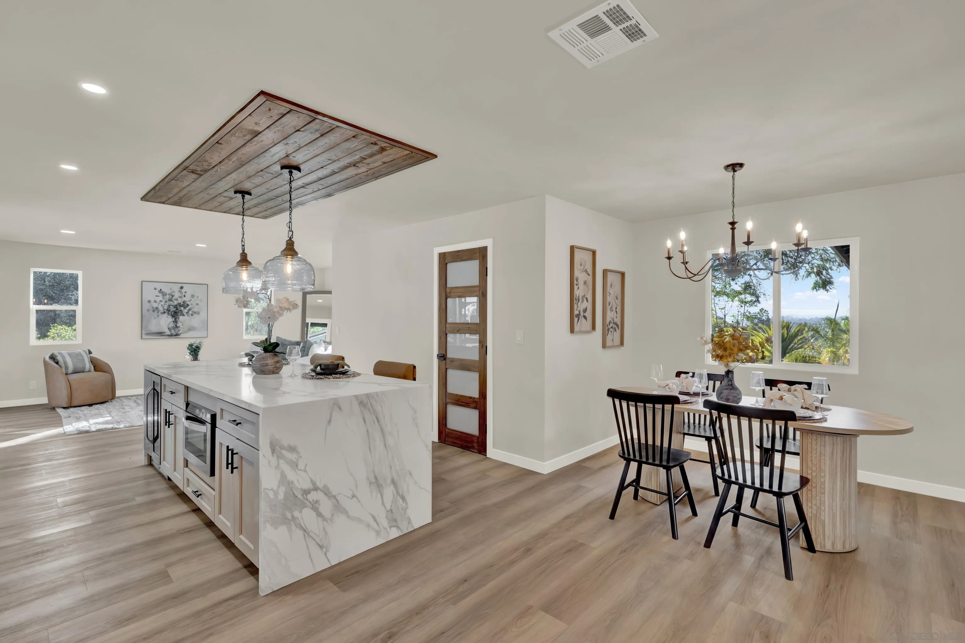 14407 Mountain Road Poway, CA 92064 - Photo 19 of 75 a view of a dining room with furniture window and wooden floor