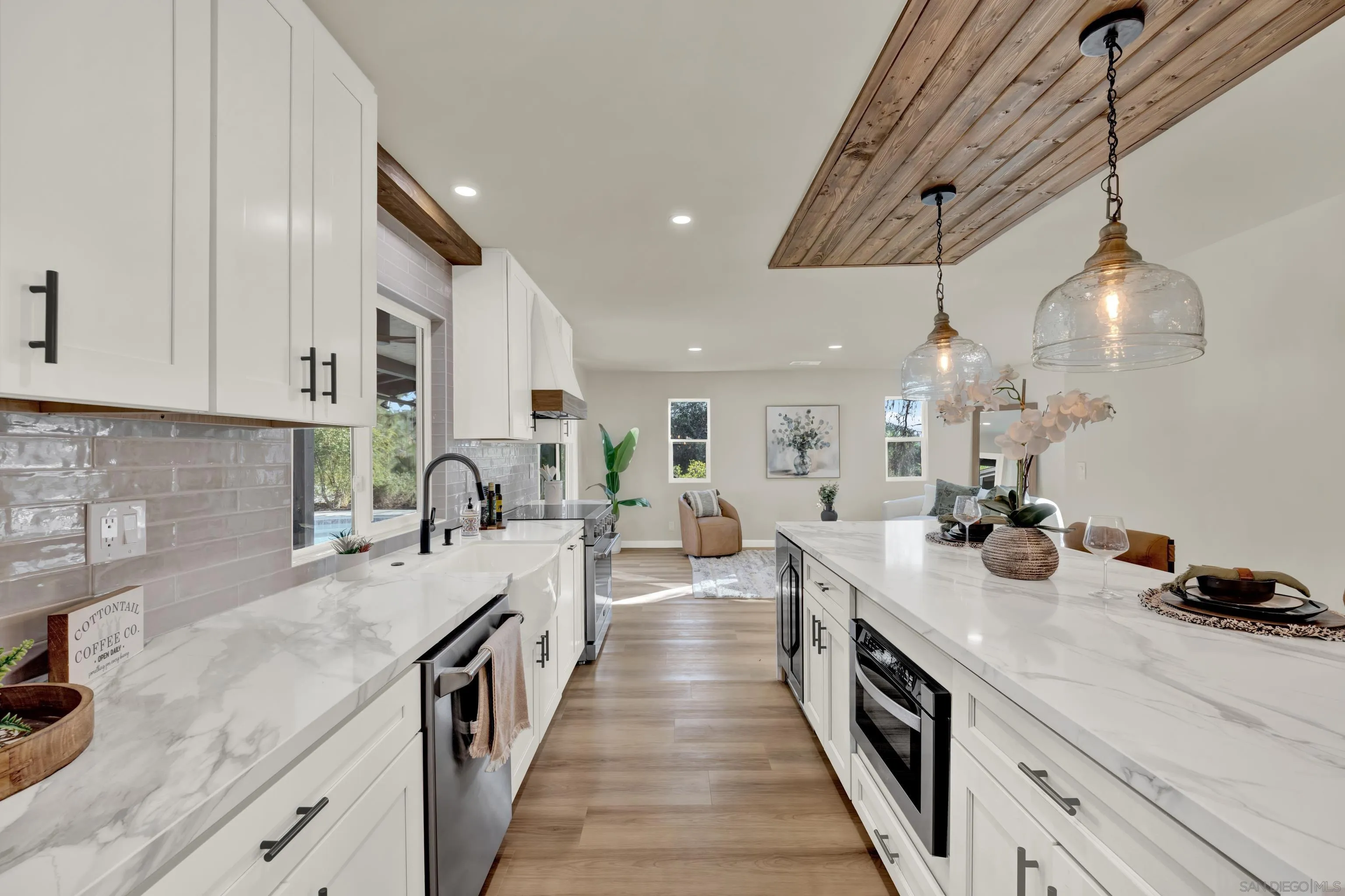 14407 Mountain Road Poway, CA 92064 - Photo 20 of 75 a large kitchen with stainless steel appliances lots of counter space and window
