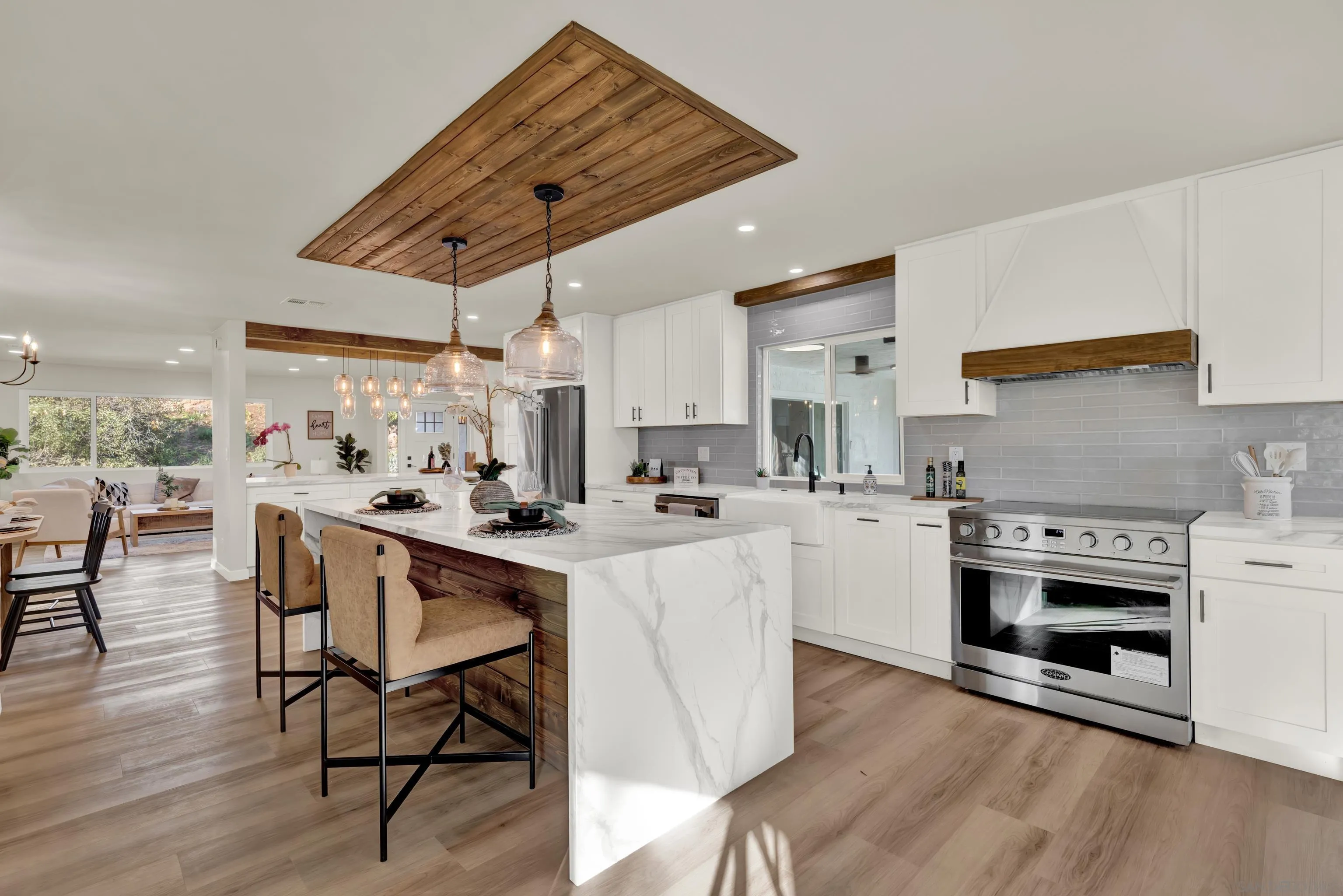 14407 Mountain Road Poway, CA 92064 - Photo 23 of 75 a kitchen with stainless steel appliances a stove a sink dishwasher and a refrigerator