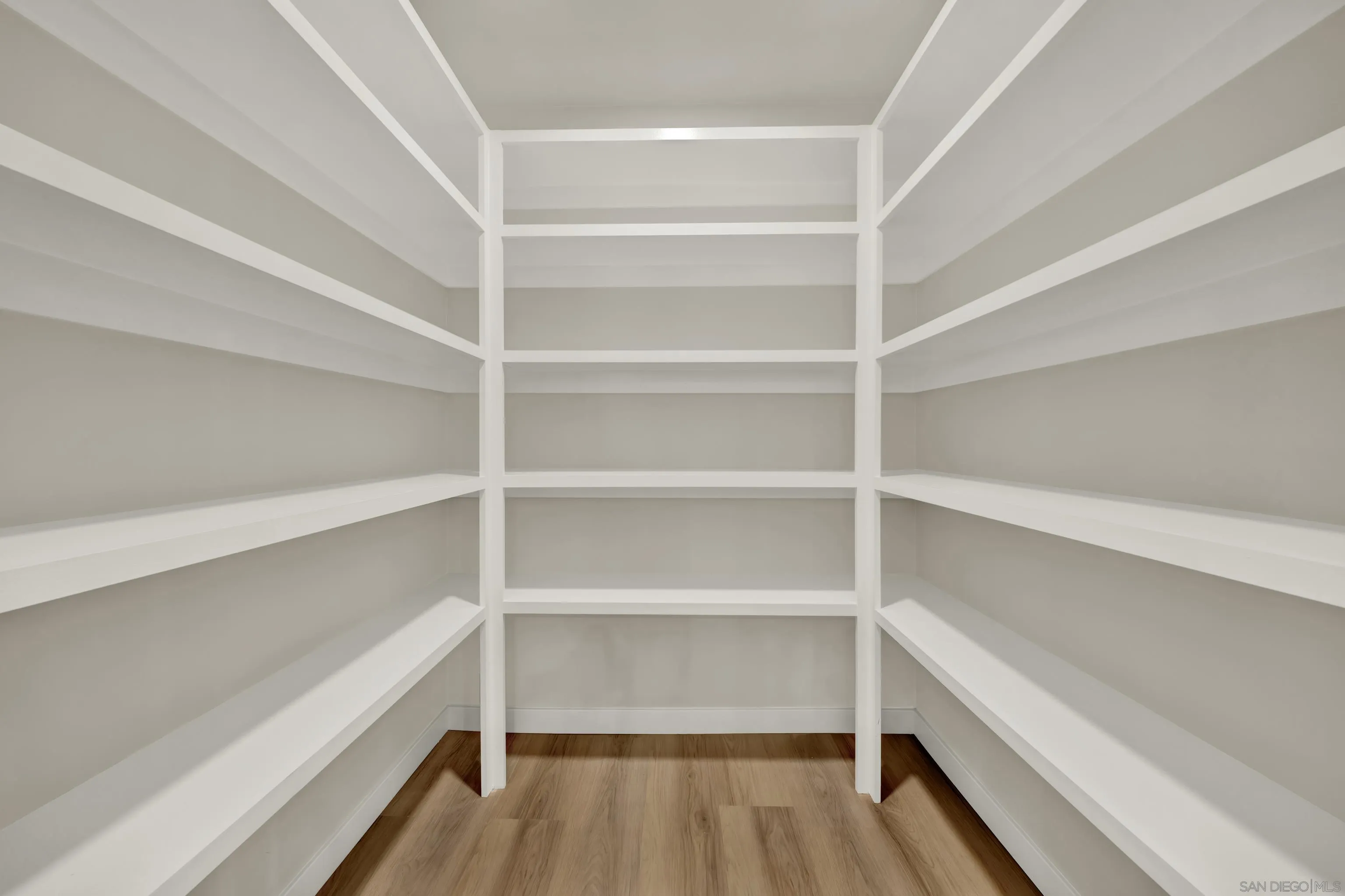 14407 Mountain Road Poway, CA 92064 - Photo 31 of 75 a view of walk in closet with empty racks