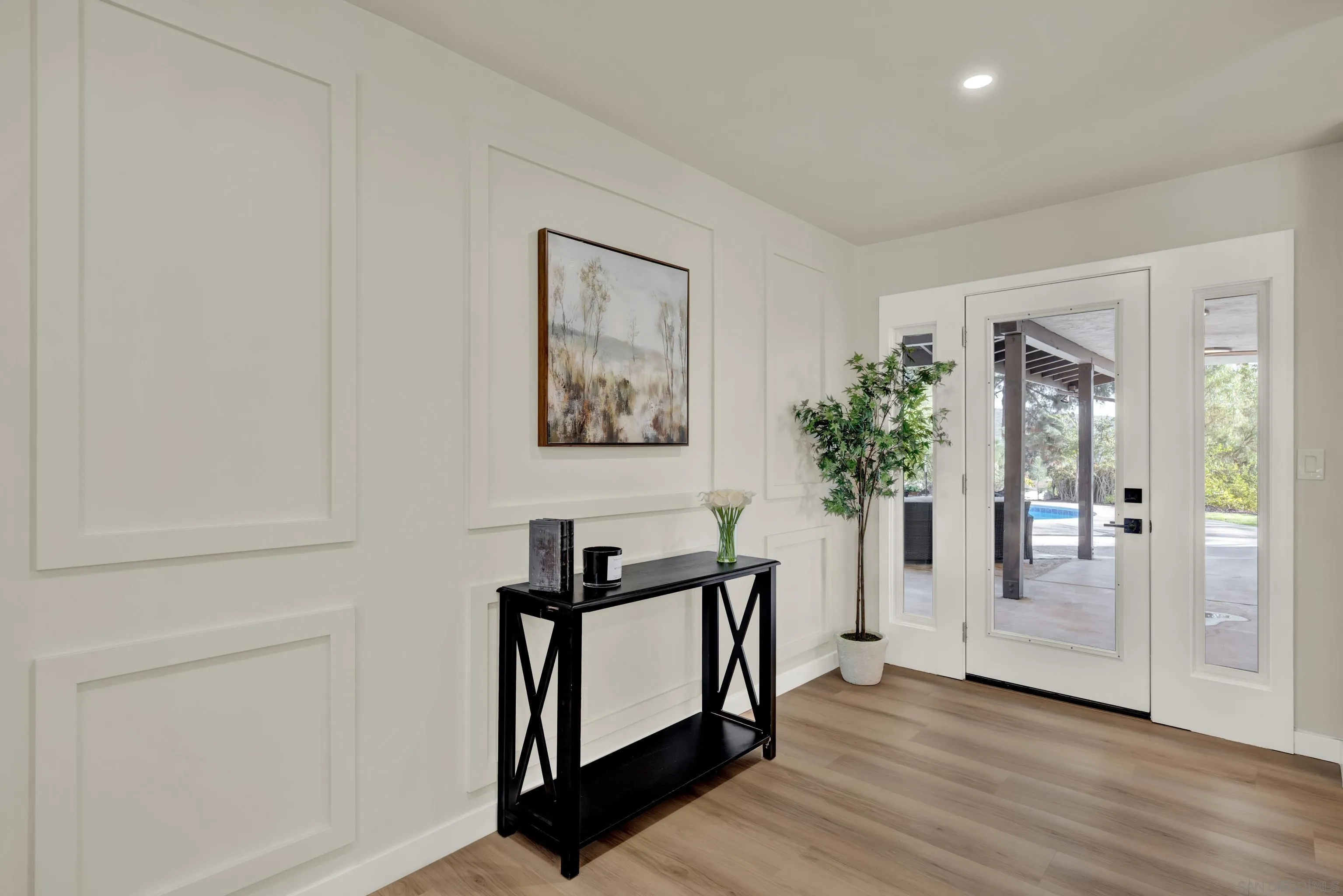 14407 Mountain Road Poway, CA 92064 - Photo 33 of 75 a view of a hallway with bathroom and wooden floor