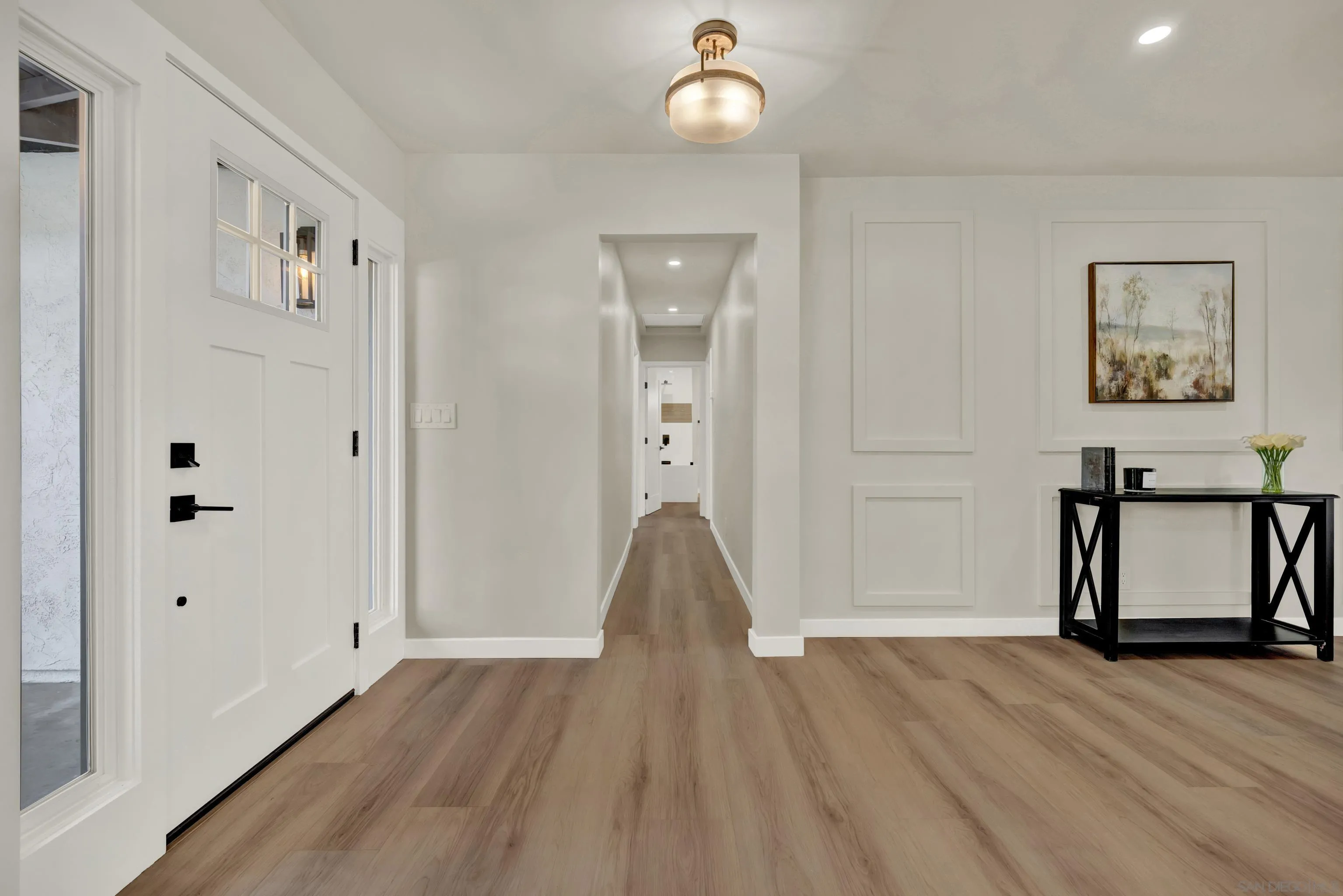 14407 Mountain Road Poway, CA 92064 - Photo 34 of 75 a view of a hallway with wooden floor and staircase
