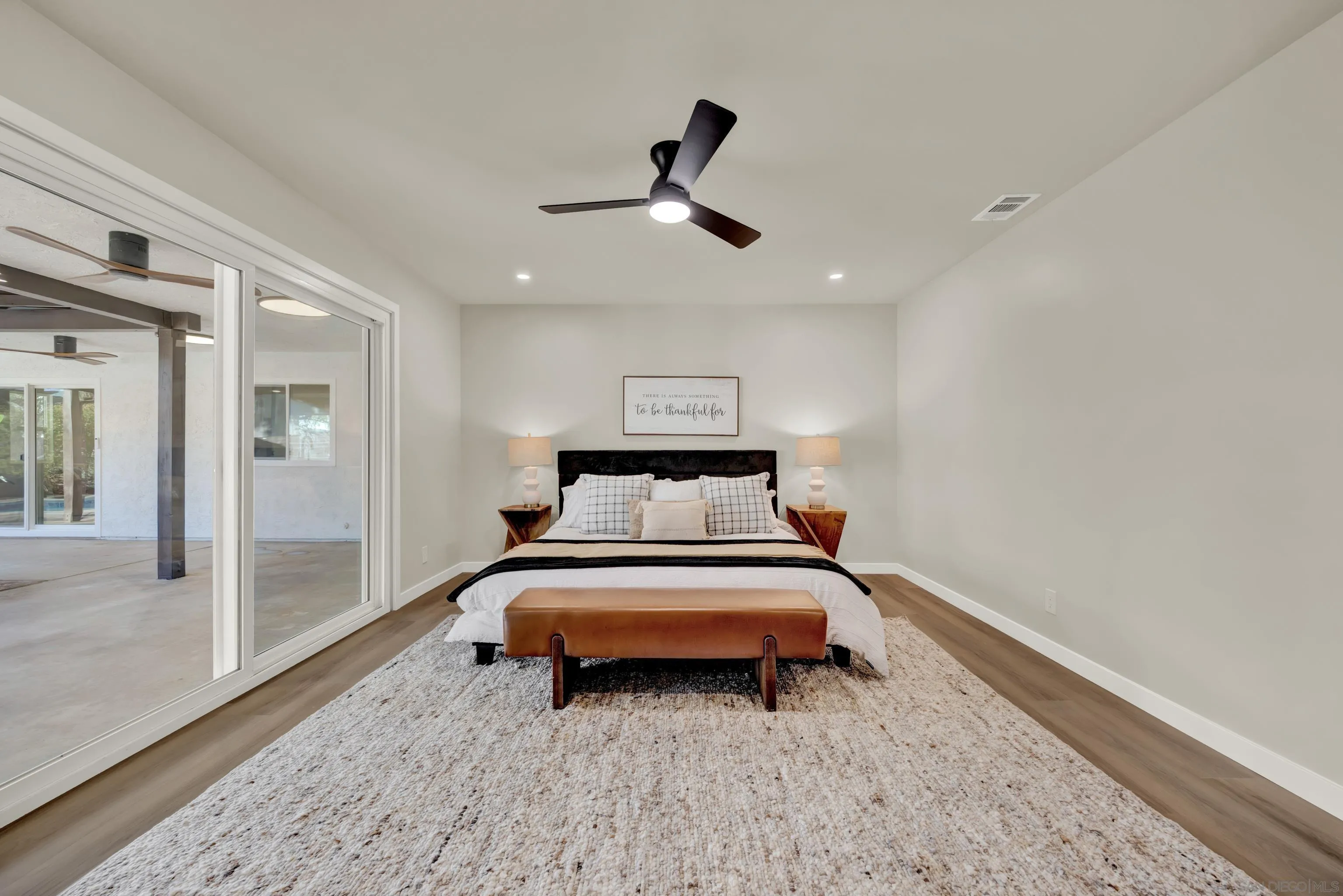 14407 Mountain Road Poway, CA 92064 - Photo 36 of 75 a bedroom with a bed and a ceiling fan