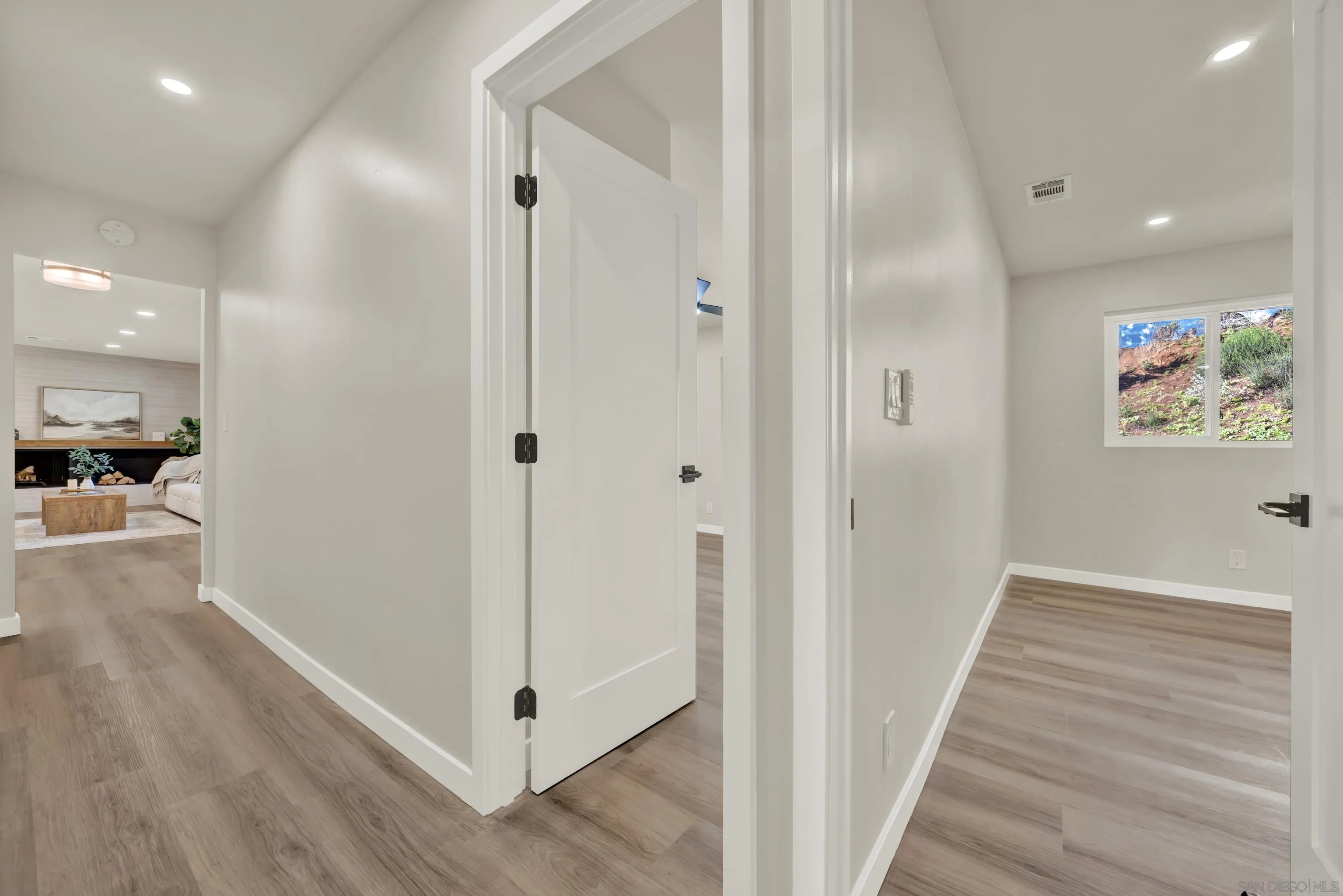 14407 Mountain Road Poway, CA 92064 - Photo 44 of 75 a view of a hallway with wooden floor
