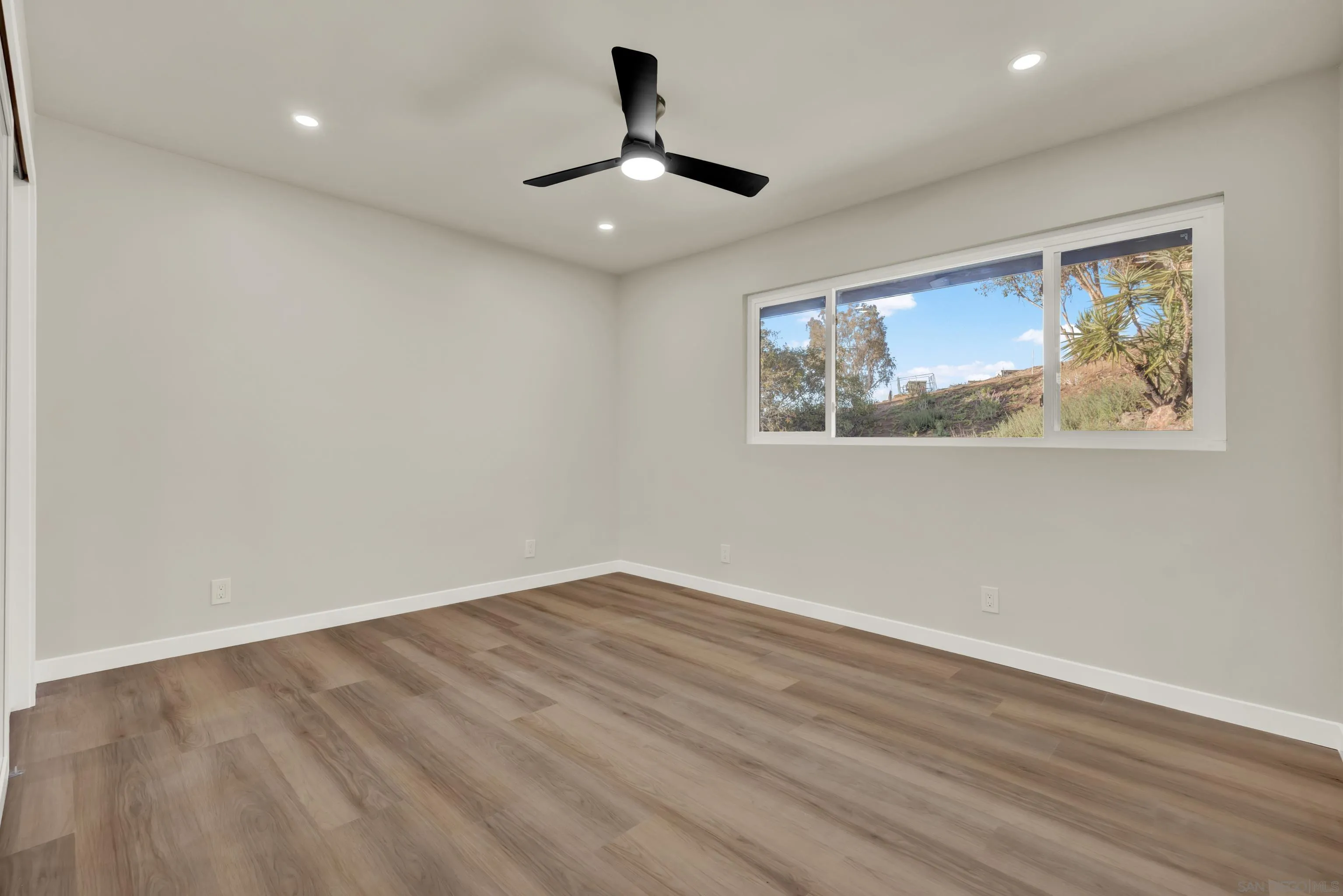 14407 Mountain Road Poway, CA 92064 - Photo 45 of 75 a view of empty room with wooden floor