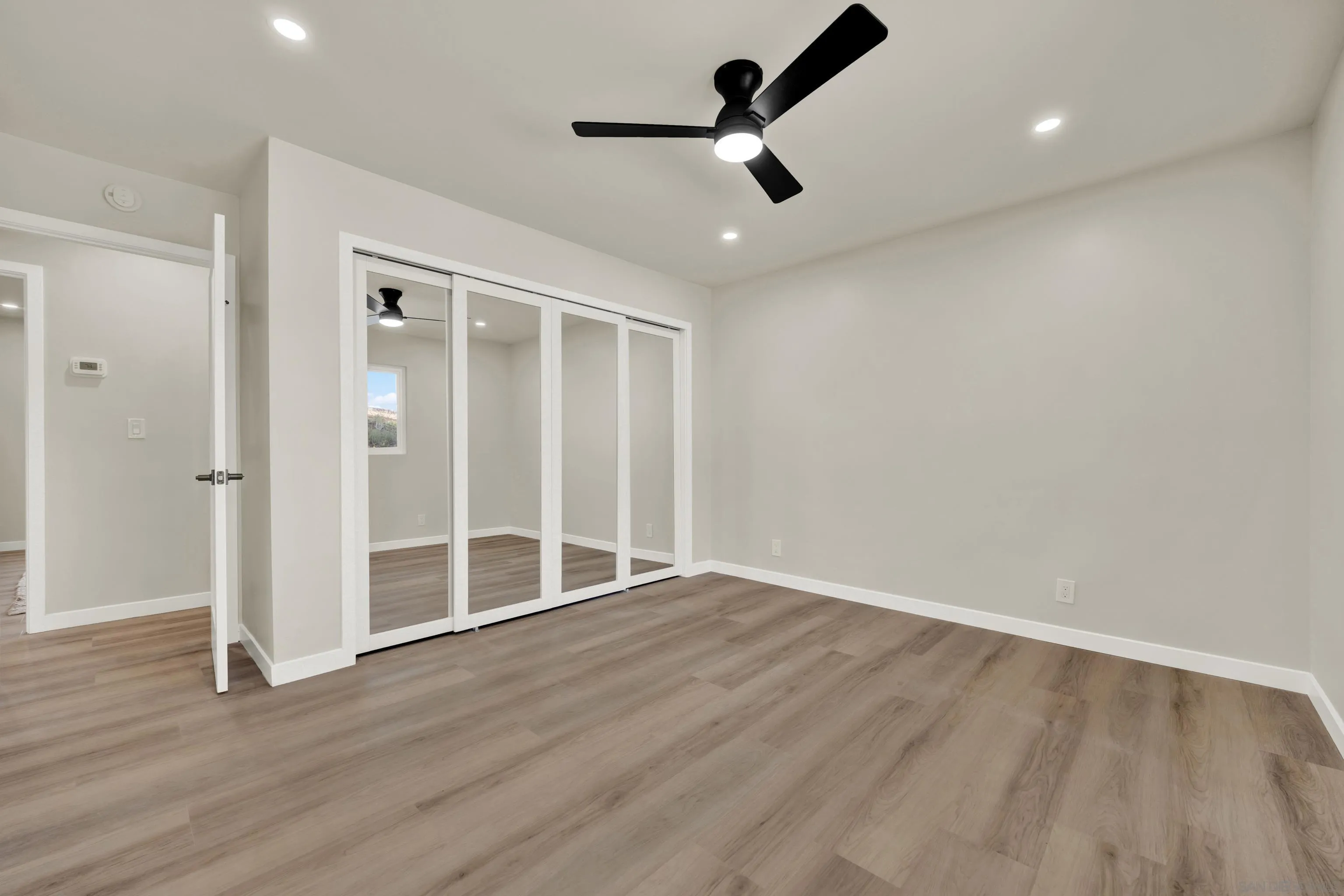 14407 Mountain Road Poway, CA 92064 - Photo 46 of 75 wooden floor in an empty room with a window