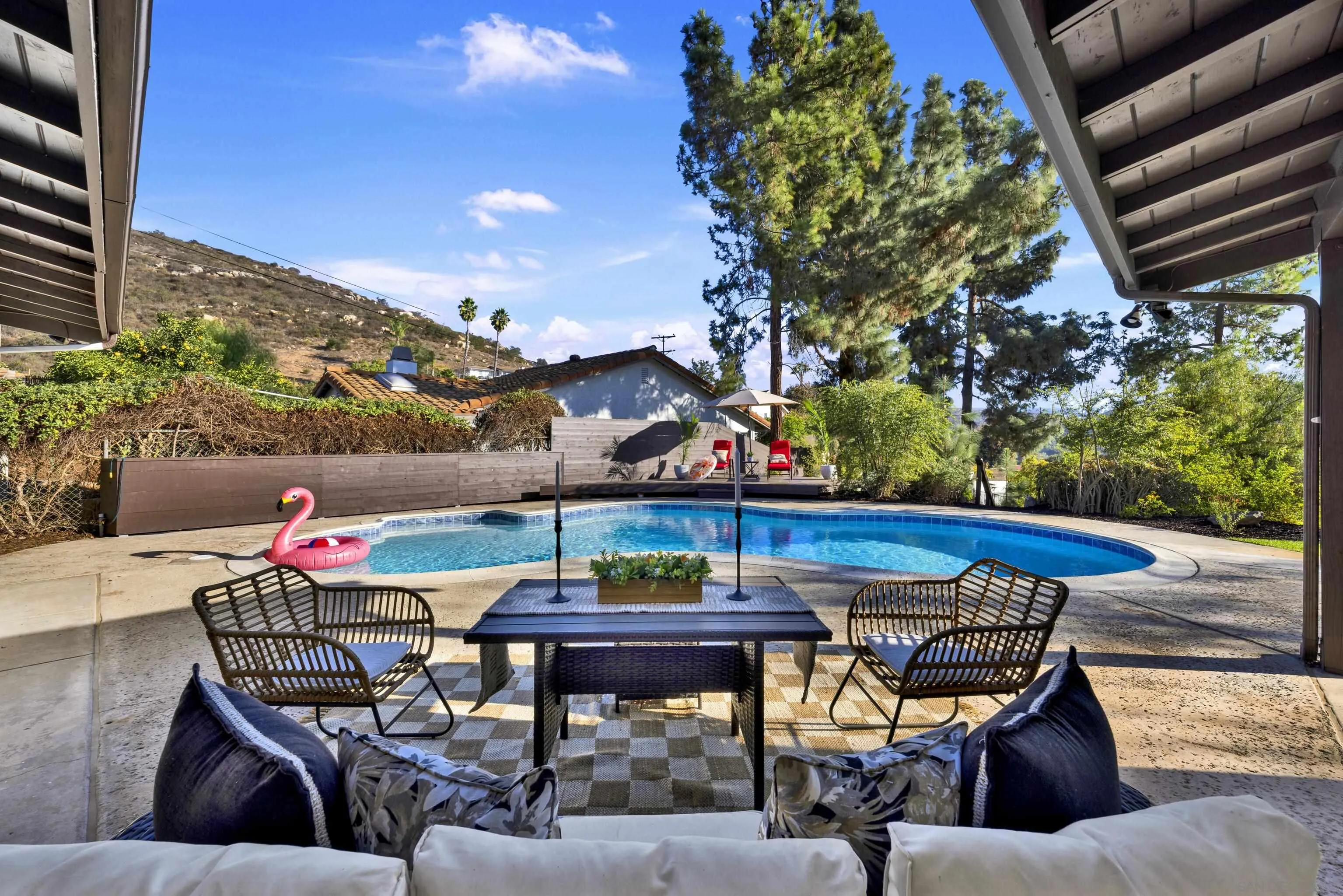 14407 Mountain Road Poway, CA 92064 - Photo 60 of 75 a view of an outdoor dining space with a table and chairs