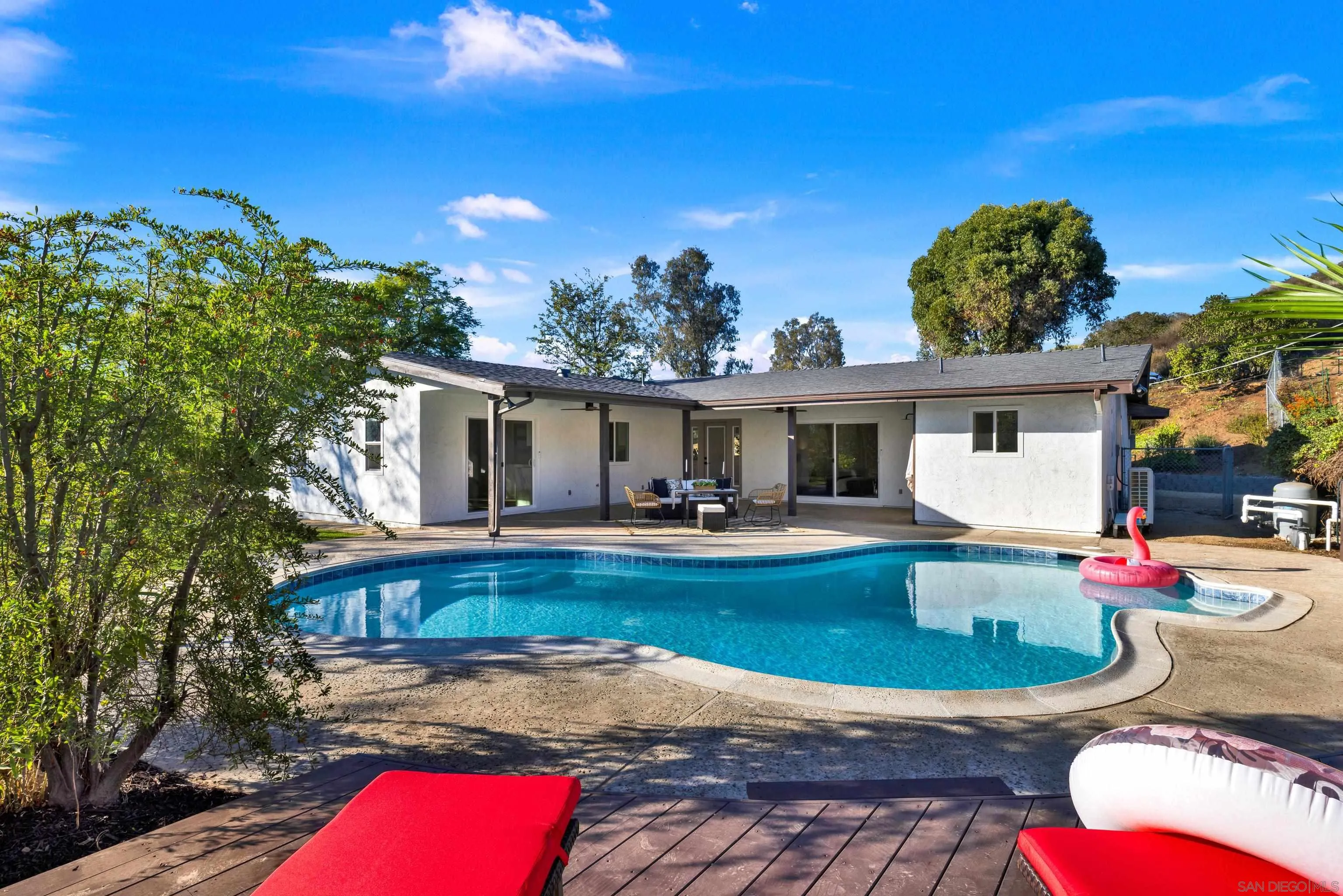 14407 Mountain Road Poway, CA 92064 - Photo 62 of 75 a view of a house with swimming pool and sitting area
