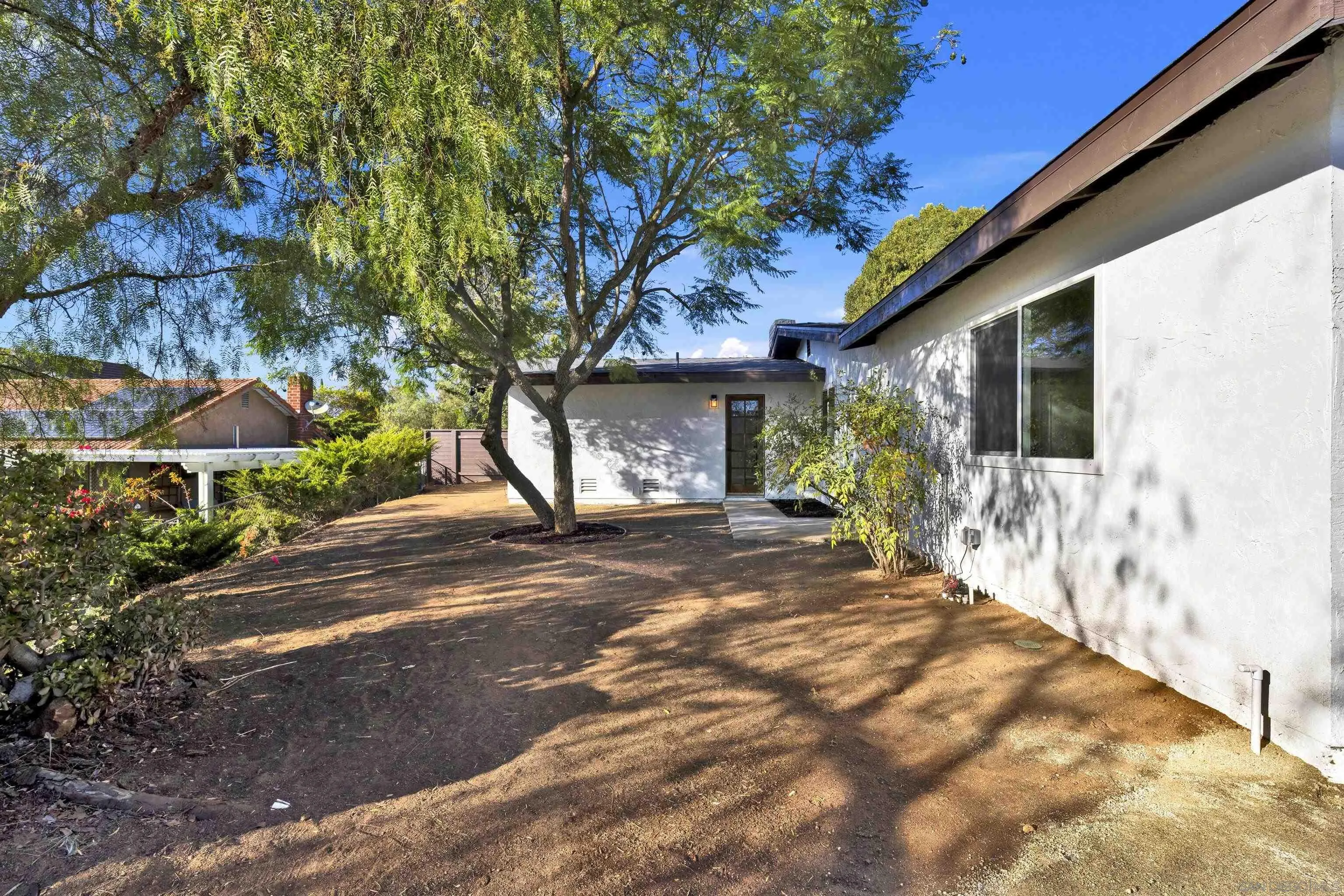 14407 Mountain Road Poway, CA 92064 - Photo 65 of 75 a view of a house with a tree in the background
