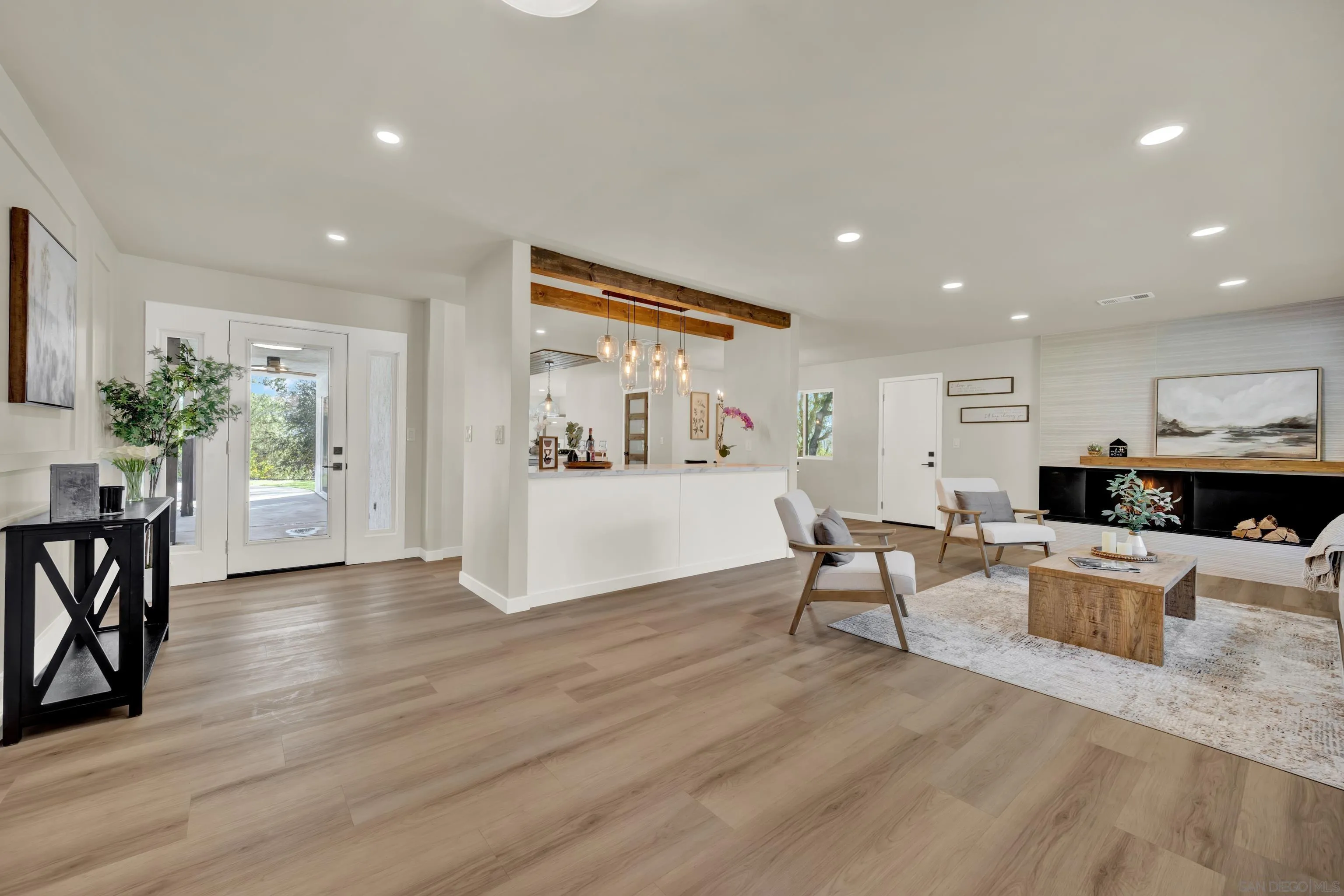 14407 Mountain Road Poway, CA 92064 - Photo 10 of 75 a living room with furniture and a wooden floor