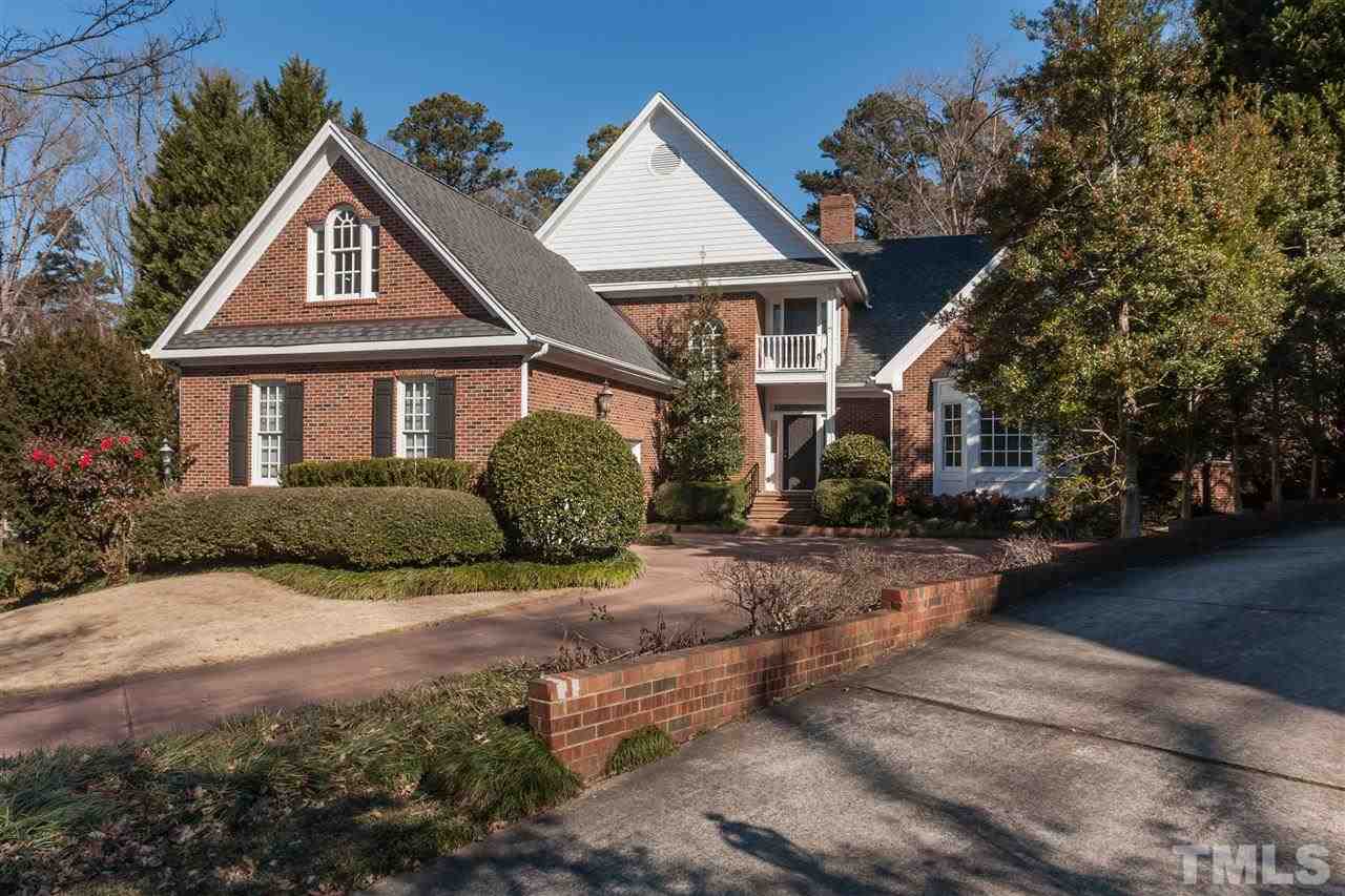 2008 Tradd Court Raleigh, NC 27607 - Photo 1 of 25 a front view of a house with a yard and garage