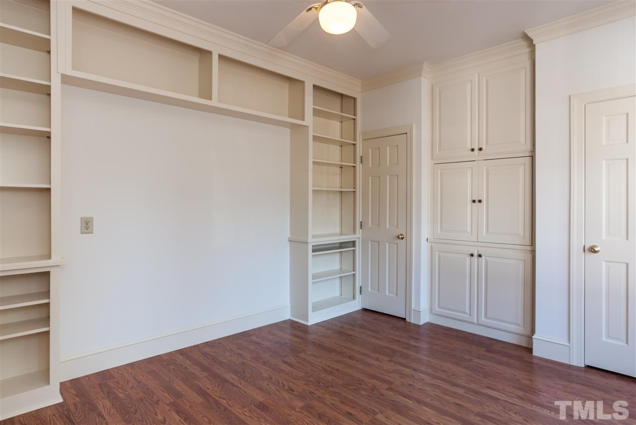 2008 Tradd Court Raleigh, NC 27607 - Photo 14 of 25 a view of an empty room with wooden floor