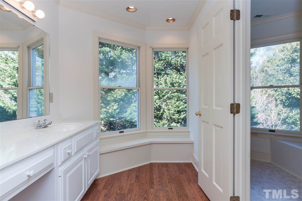 2008 Tradd Court Raleigh, NC 27607 - Photo 19 of 25 a view of bathroom with a window and a sink