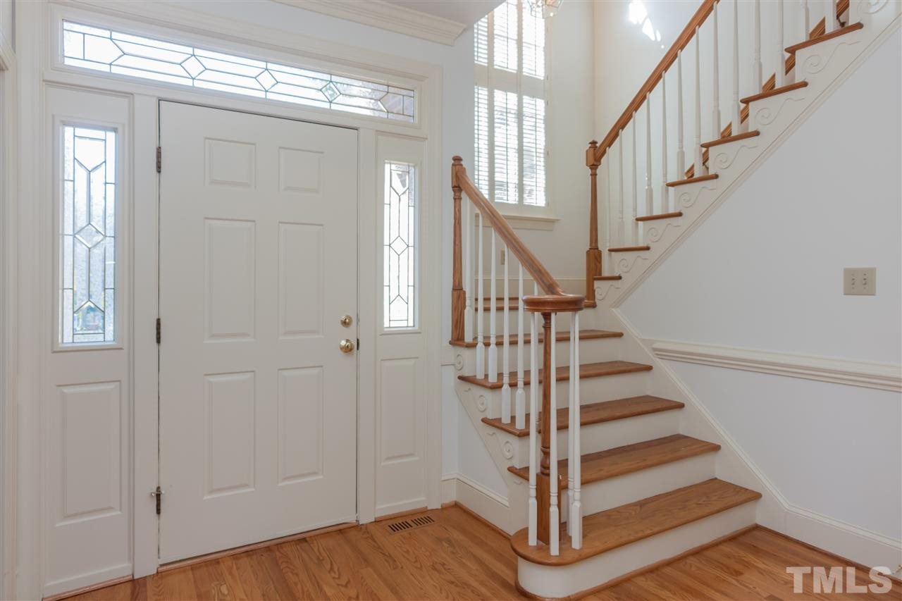 2008 Tradd Court Raleigh, NC 27607 - Photo 3 of 25 a view of entryway with wooden floor and front door