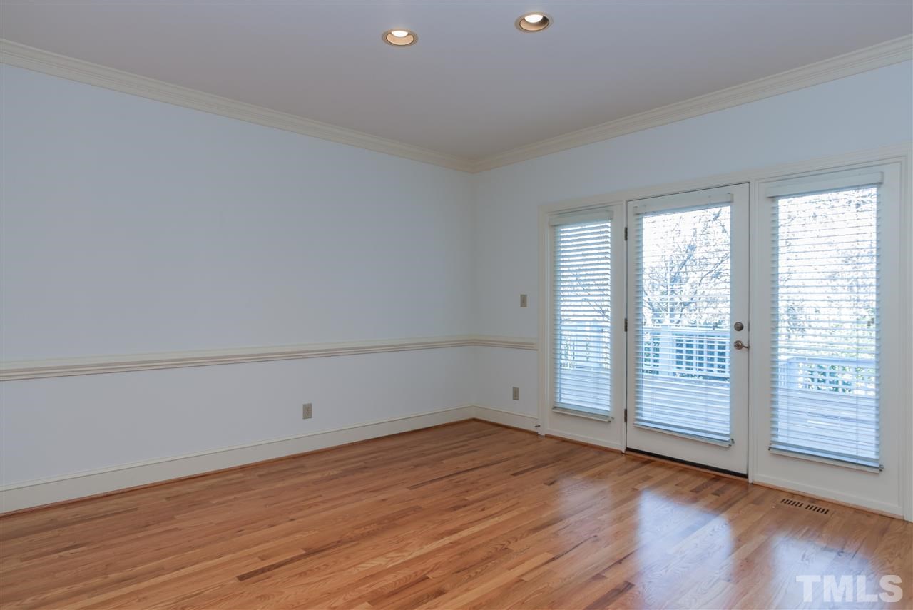 2008 Tradd Court Raleigh, NC 27607 - Photo 6 of 25 wooden floor in an empty room with a window