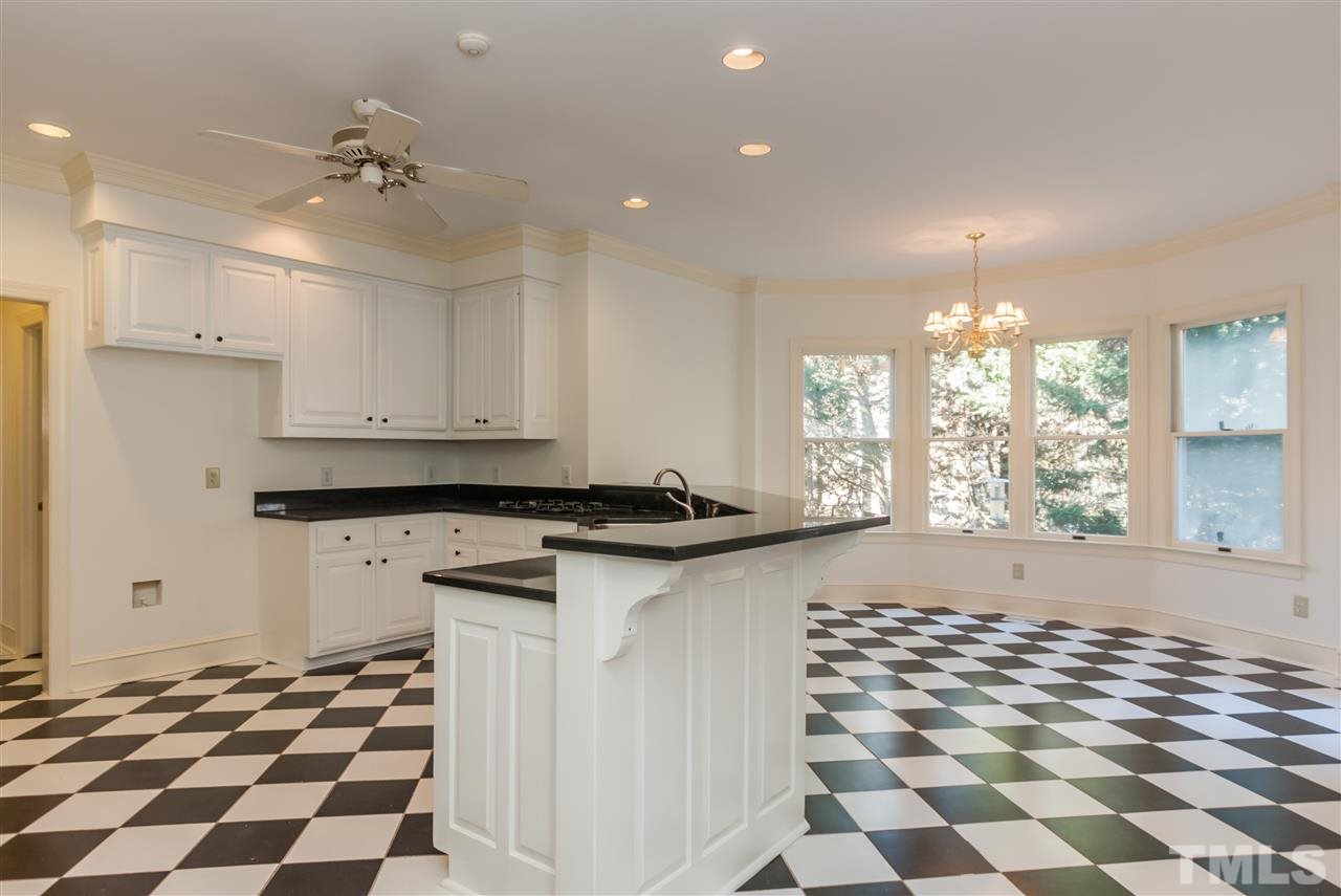 2008 Tradd Court Raleigh, NC 27607 - Photo 8 of 25 a kitchen with granite countertop stainless steel appliances a sink and a cabinets