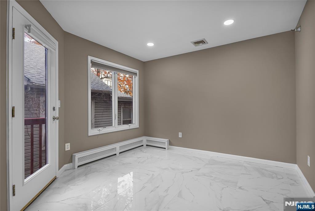 75 West Columbia Avenue, Unit 2 Palisades Park, NJ 07650 - Photo 6 of 27 a view of an empty room with a window