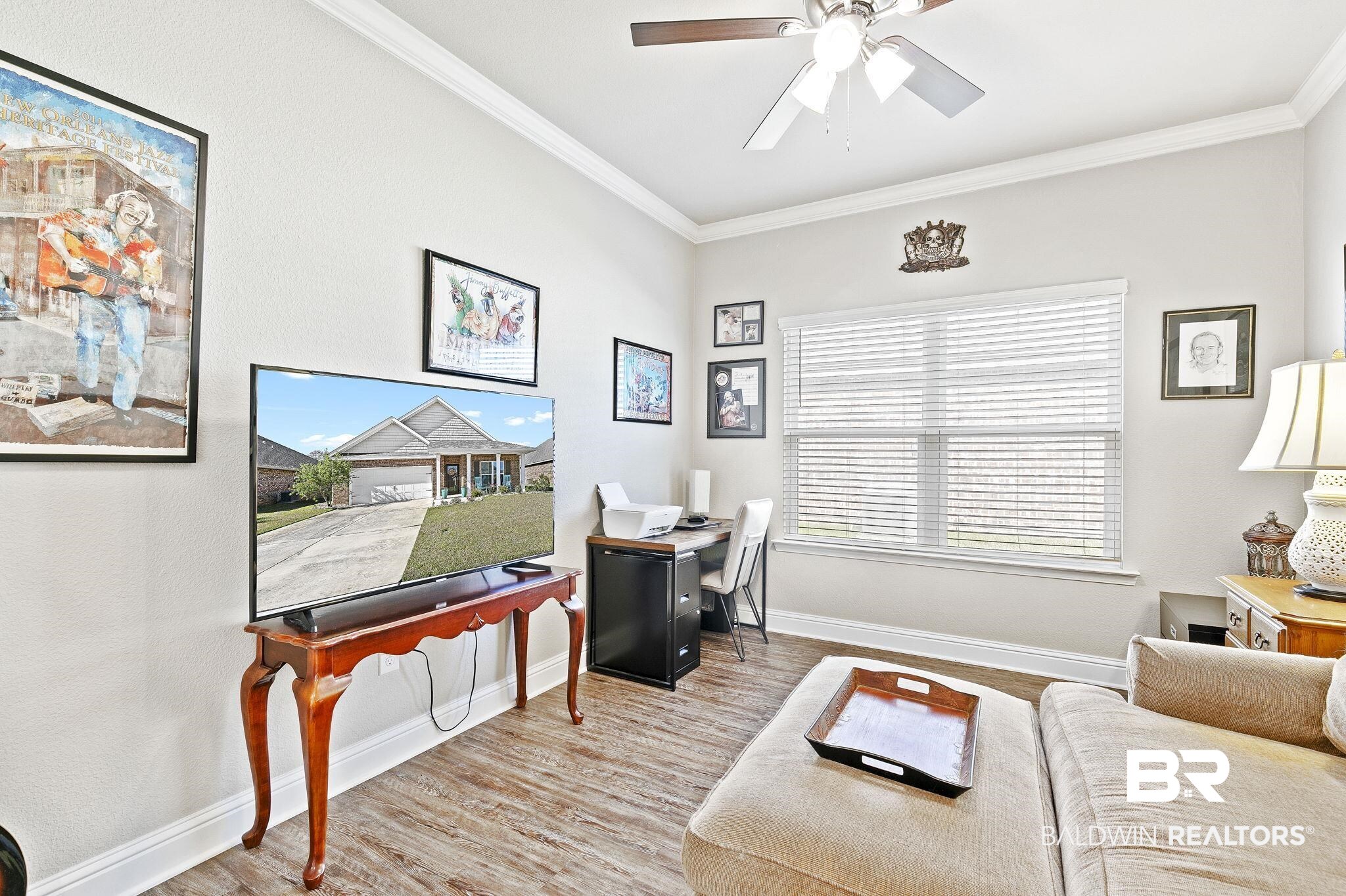 1319 Kairos Loop Foley, AL 36535 - Photo 34 of 64 Home office featuring ceiling fan, ornamental molding, and light hardwood / wood-style flooring