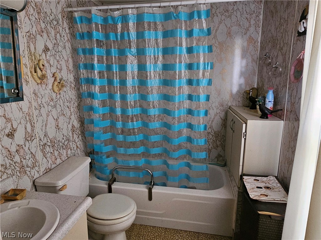 40497 Hanover Ridge Road Cadiz, OH 43907 - Photo 12 of 13 Full bathroom with shower / bathtub combination with curtain, tile floors, toilet, and vanity