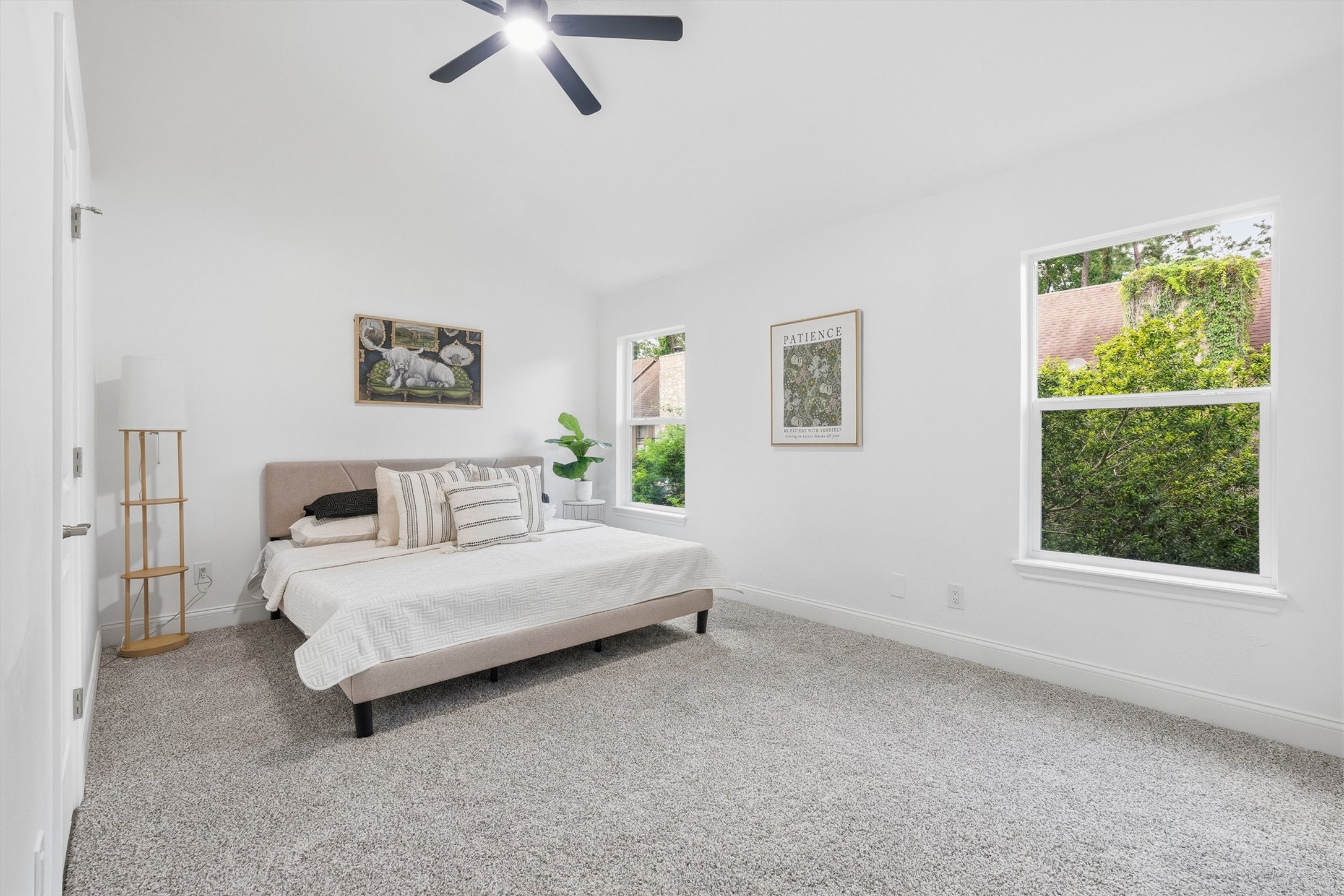 1011 Hamblen Road, Unit 306 Houston, TX 77339 - Photo 20 of 38 The second primary suite offers plush carpet, a ceiling fan, a walk-in closet, and its own tile en-suite bath, comfort and privacy in one.