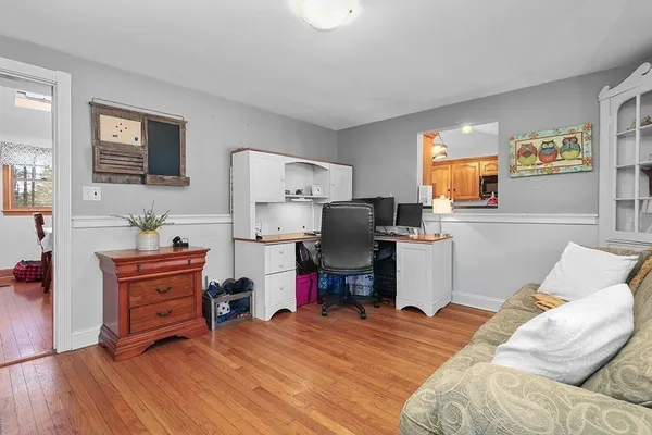 a bedroom with furniture and a wooden floor