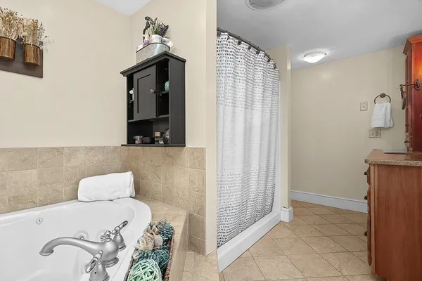 a bedroom with a bed and a mirror