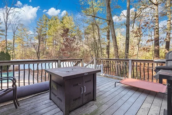 a balcony with furniture and wooden floor