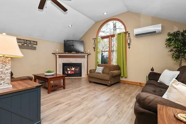 a living room with furniture and a fireplace
