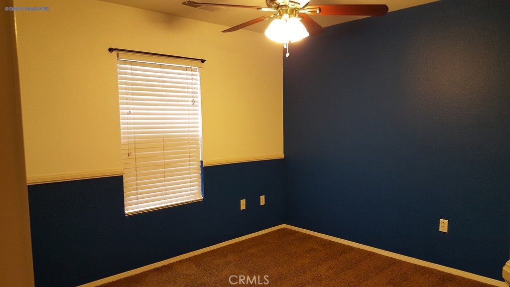 31771 Biagio Way Winchester, CA 92596 - Photo 25 of 44 a view of a livingroom with a window