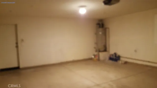 a view of a livingroom with stairs and furniture