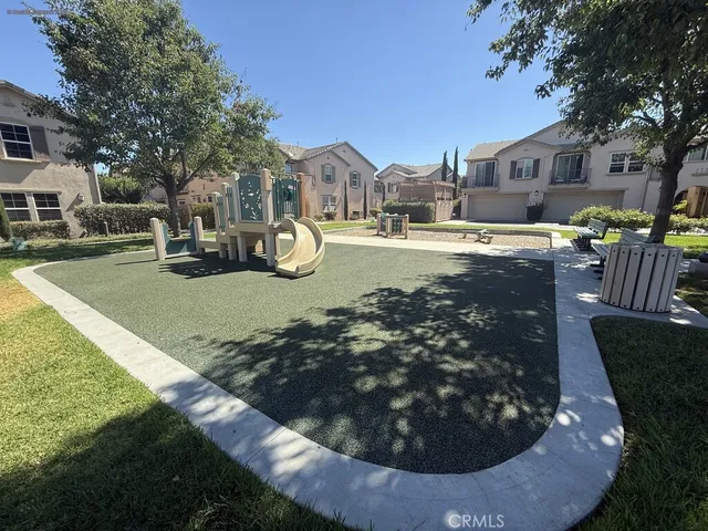 a view of a swimming pool and a yard