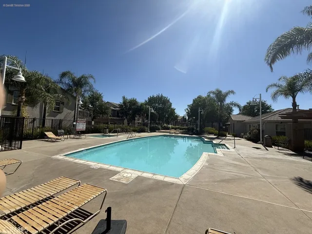 a view of a street that has couple of cars parked on the road