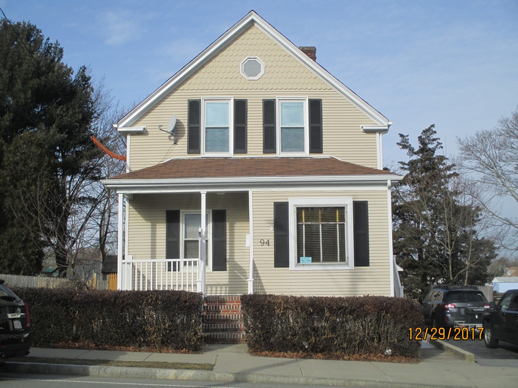 94 Howland Road Fairhaven, MA 02719 - Photo 1 of 2 a front view of a house with a yard
