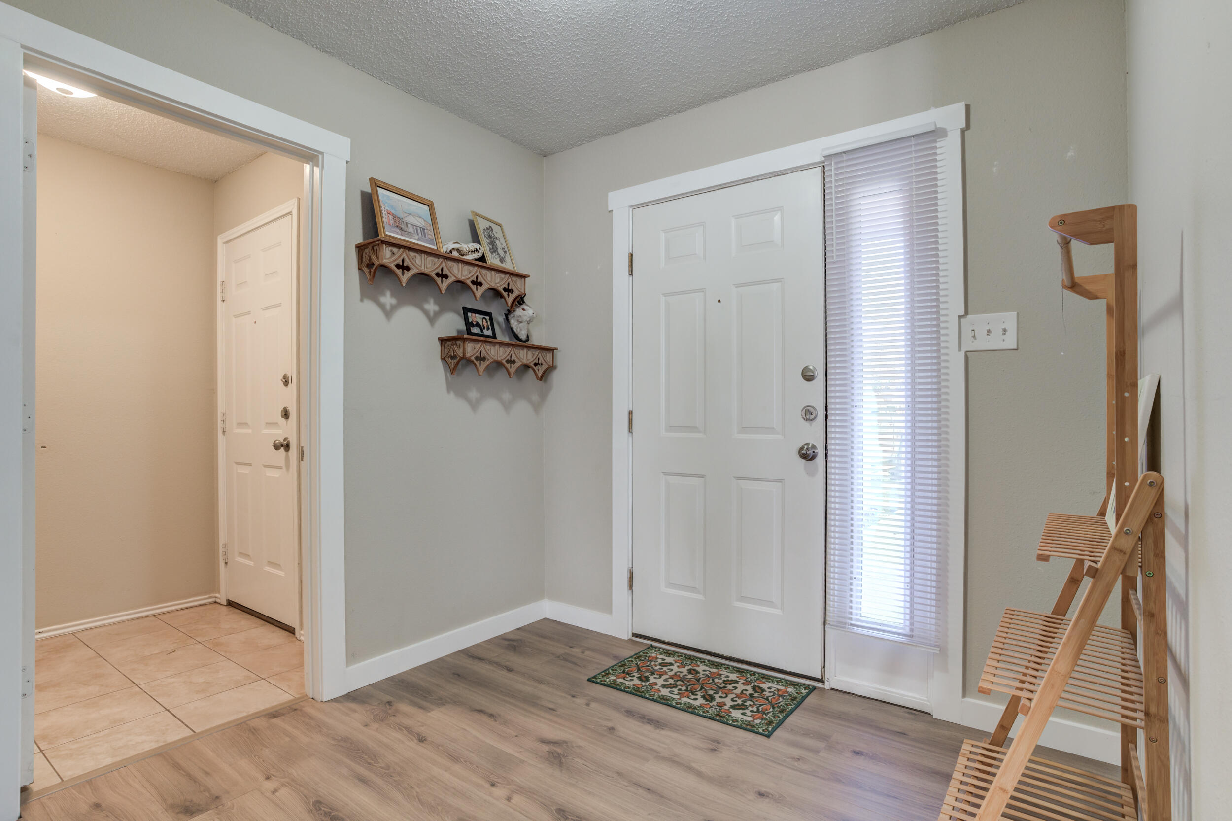 8406 Canton Avenue Lubbock, TX 79423 - Photo 2 of 25 a view of a hallway view with wooden floor and staircase