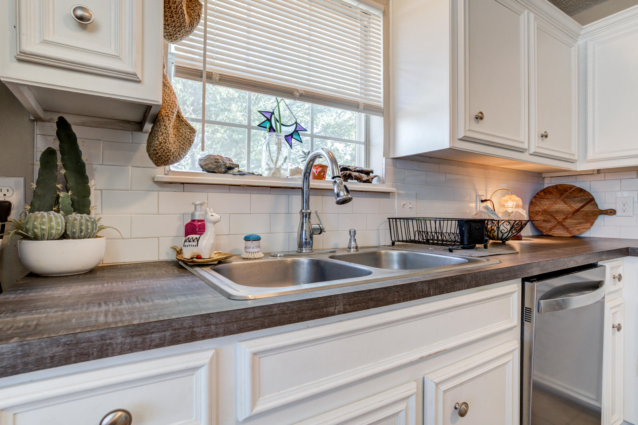 8406 Canton Avenue Lubbock, TX 79423 - Photo 5 of 25 a kitchen with sink and window